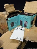 Open shipping carton showing multiple Vornado mineral cartridge boxes