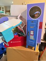 Locker, desk and boxed accessory set stacked together