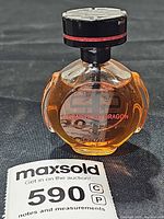 Front view of Cartier Le Baiser Du Dragon 1 oz perfume bottle showing label, liquid level and cap