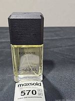 Front view of Chanel Égoïste 3.4 oz eau de toilette spray bottle with cap and lot tag