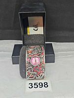 Watch on foam insert with open Chi by Falchi box