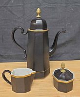 Full view of coffee pot, creamer and sugar bowl