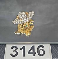 Front view showing rhinestone detail and green eyes