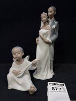 Wedding couple and child angel figurines grouped