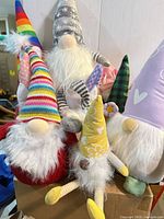 Group of plush gnomes showing variety of hat patterns and colors