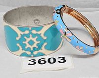 Both bracelets side by side showing relative sizes, colors, and lot tag