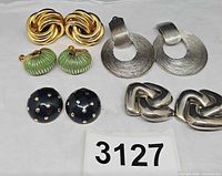 All five pairs of clip-on earrings displayed