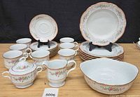 Full view of Mikasa Ribbon Pink dinnerware showing plates, teacups, sugar bowl, creamer and serving bowl