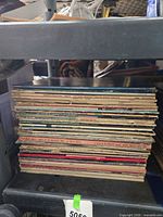 Side view of entire stack of LP records on shelf