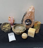 Group shot of all seven stone items on table