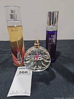 All three perfume bottles front view