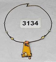 Full view of collar necklace showing pendant and scattered cabochons