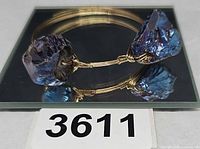 Bangle on mirror showing wire wrap and two stones