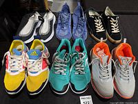 All six pairs of sneakers arranged in two rows