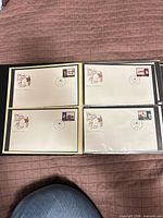 Binder page showing four 1989 Canadian 38¢ first day covers in plastic sleeves