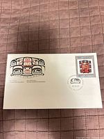 Full view of first day cover showing artwork, stamp and cancellation