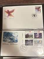 Two 1990 Canadian FDCs in album sleeve: Literacy cover on top, Mythical Creatures cover beneath