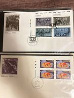 Both FDCs in protective sleeves showing stamps and cachets