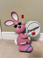 Full view Energizer Bunny coin bank with drum