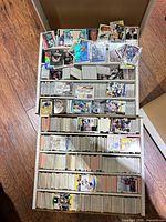 Full five-row cardboard storage box filled with hockey trading cards