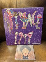 Front cover of 1999 LP and sealed HitnRun CD visible