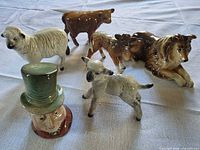 Overall group of ceramic figurines and jug on table