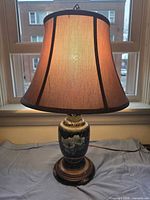 Full view of lamp with shade illuminated