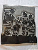 Full view of engraved Inuit family slate plaque