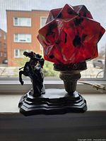 Full lamp showing base sculpture and starburst shade