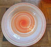 interior view showing orange and white swirl pattern and glossy finish