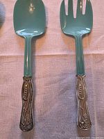 Pair with ornate floral handles close-up