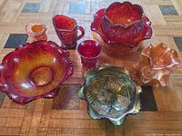 Group shot of all seven carnival and pressed glass pieces