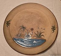 Full view of round Khair ceramic platter showing entire painted scene