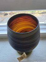 Top view showing amber-orange interior swirl