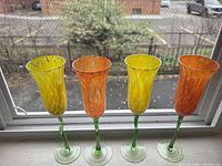 Front view of all four flutes on windowsill