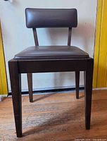Front view of dark brown Singer sewing storage chair, seat in place