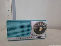 Front view showing Westinghouse branding, speaker grille, tuning dial