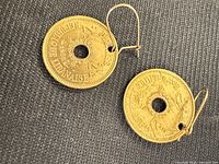 Front view of both coin earrings showing date 1955 and French inscription