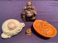Group shot of four Buddha figurines