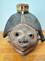 Front view of Yoruba Gelede mask showing overall form and wear