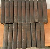 Front view of all 20 leather-bound volumes standing and laid flat