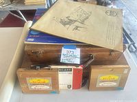 Overall lot showing wooden paint box, Guitar boxes, Colorcast board and sketch sheet