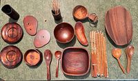 All thirteen wooden pieces laid out on tabletop