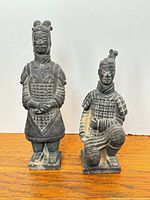 Front view of both terracotta warrior figurines
