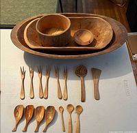 Group shot showing all bowls, dishes, forks, scoopers, spoons and spatula