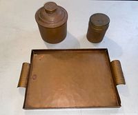 rectangular hammered copper tray with two tobacco jars