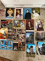Overview of mixed postcards including art reproductions and European landmarks