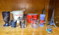 Group shot of all ten items on wooden shelf