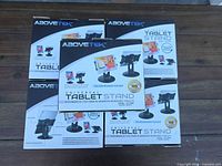Front view of five AboveTEK tablet stand boxes