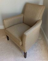Full view of upholstered arm chair front/side